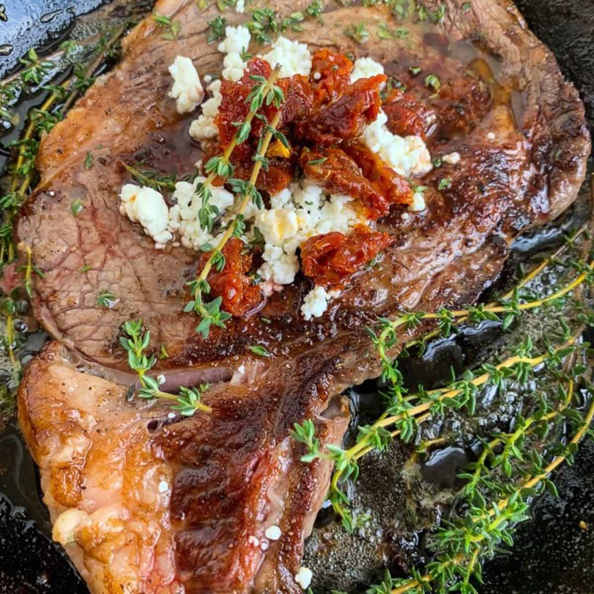 Pan-Seared Ribeye Steaks with Goat Cheese and Sun-Dried Tomatoes